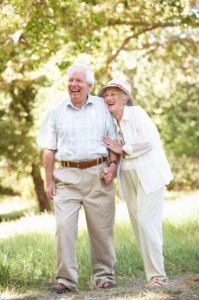 Senior Couple Walking In Park